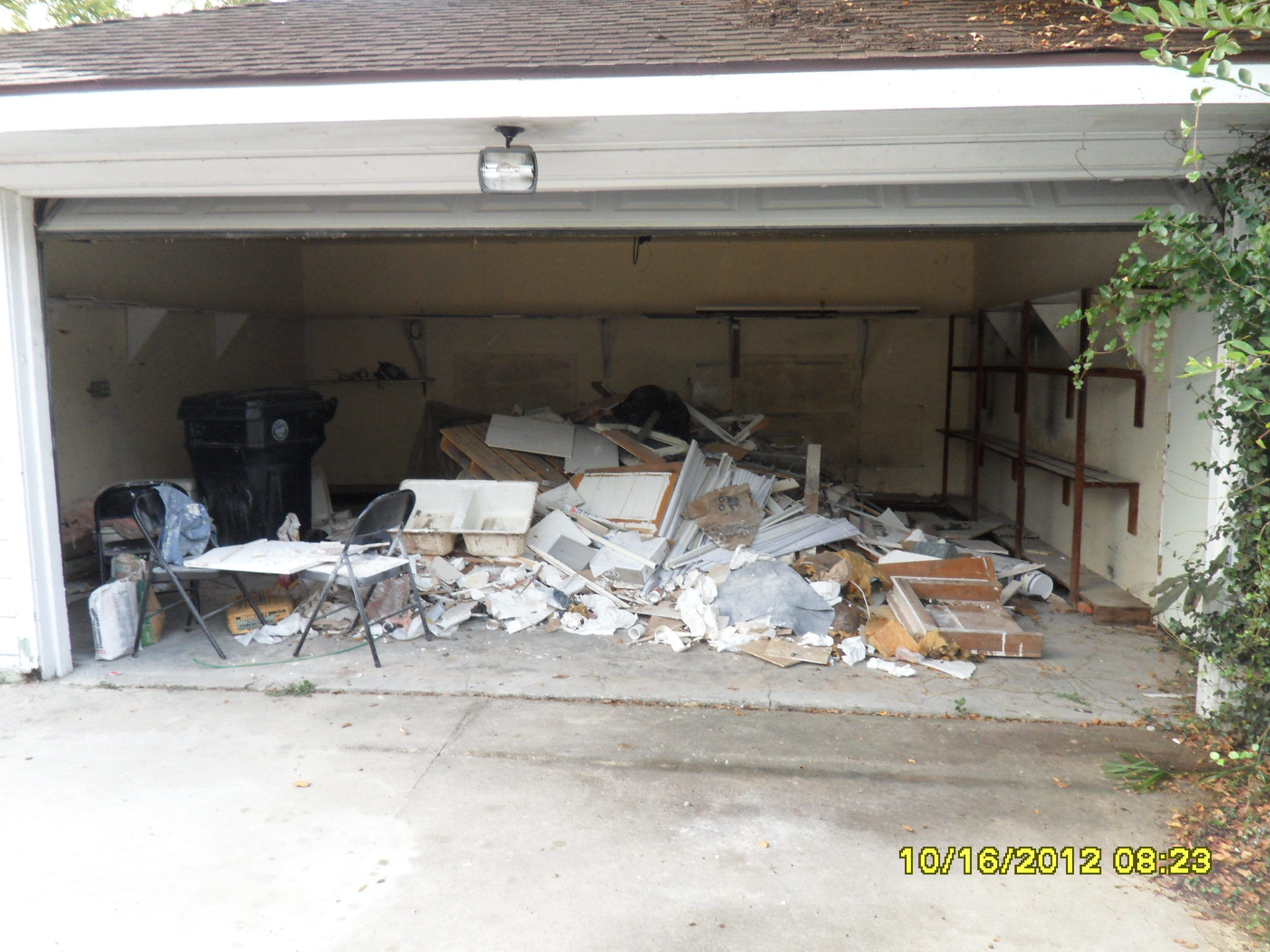 debris and trash stored in garage