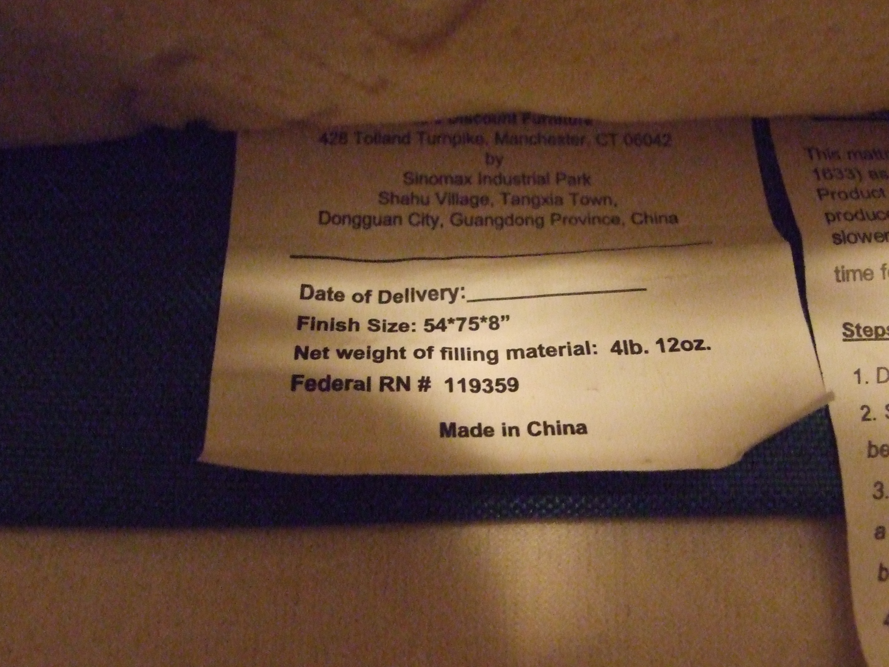 shows the tag on the mattress verifying the size