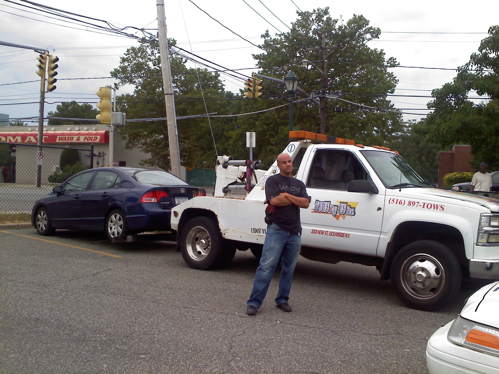 Here he stands proud as this goon ripped me off $50. From Al's Towing Oceanside NY