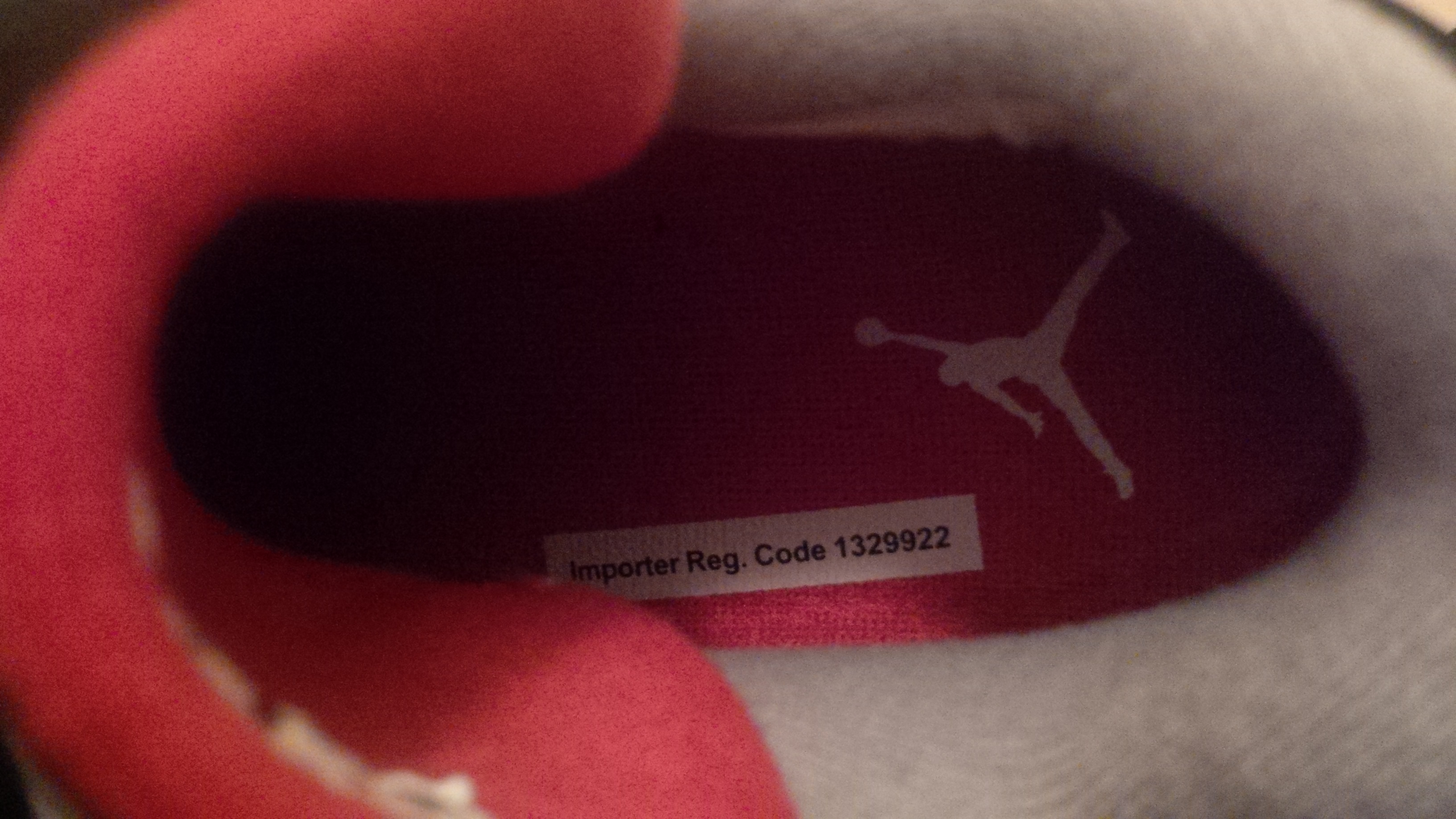 Tags on insole of left sneaker