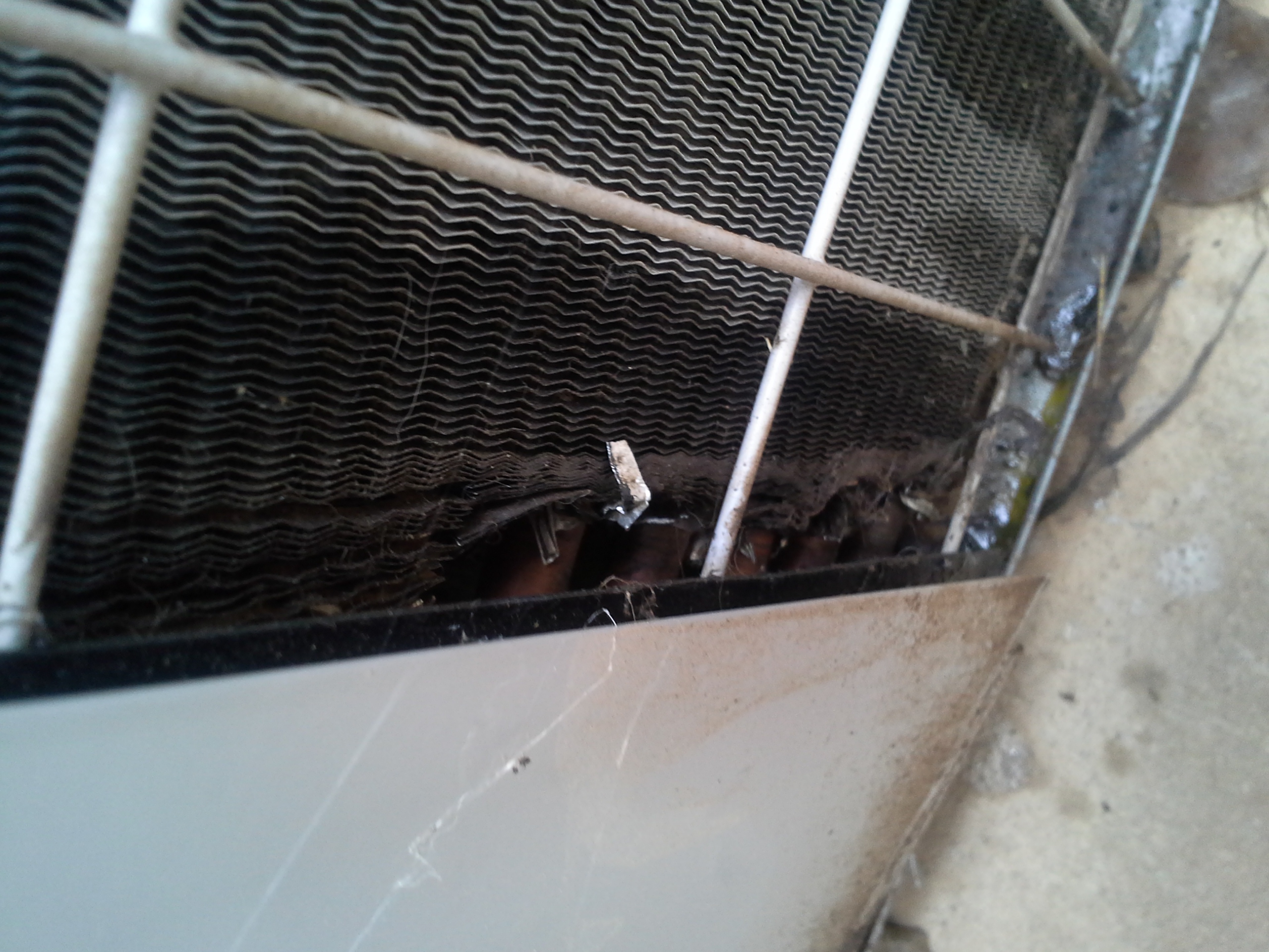 Damage to air conditioning unit with leak. 