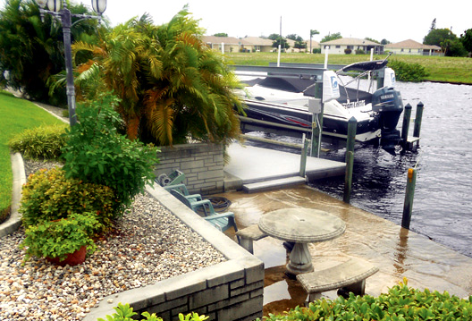 My Hurricane deck boat with Yamaha Outboard Motor dockside at my house in Cape Coral. Florida.