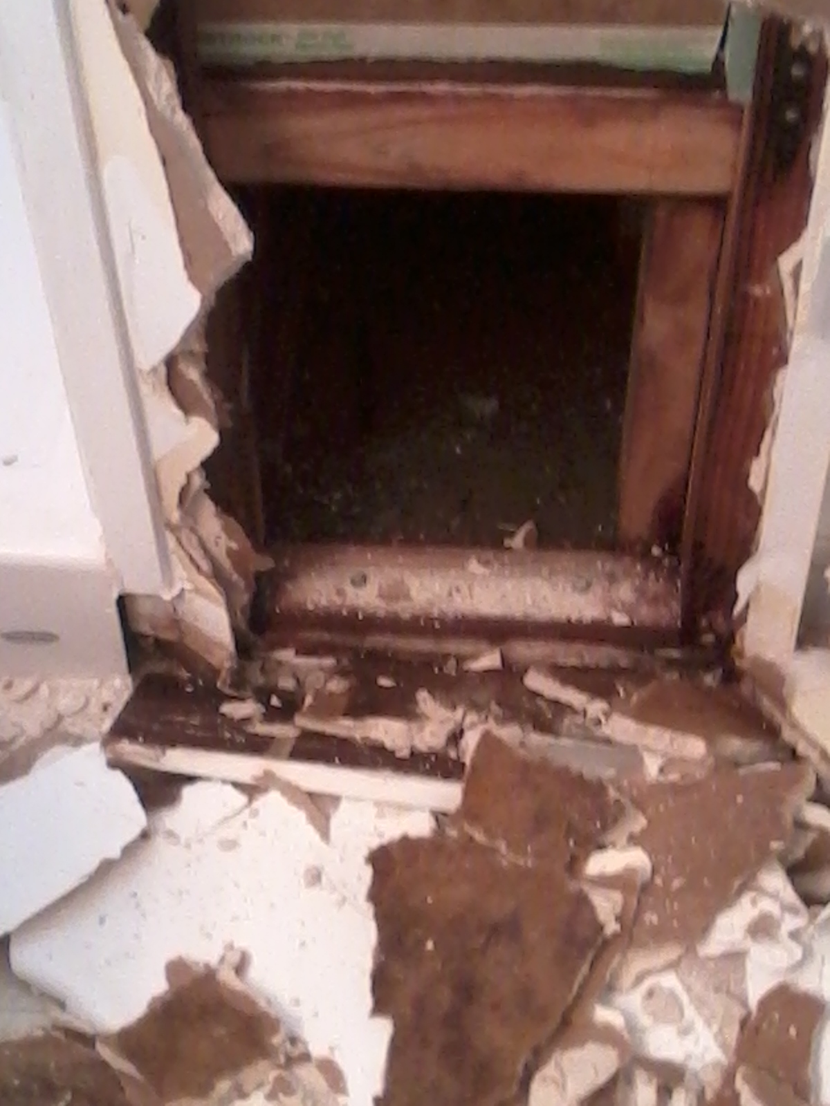 Water damage under the shower seat. Water has Saturated the drywall and 2 x 4's.