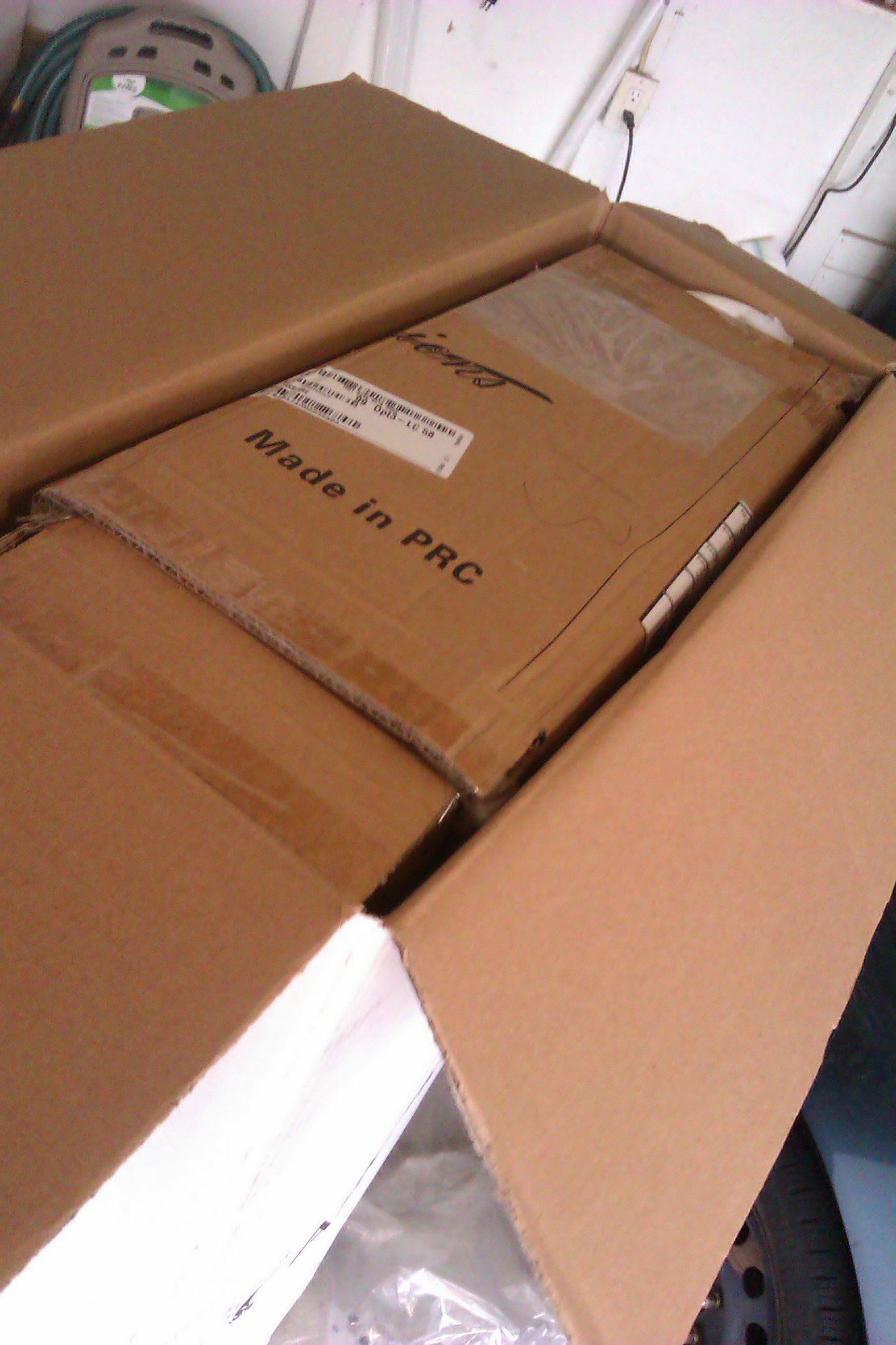 Non-working unit packaged for shipping in a box provided by ArctiCold.