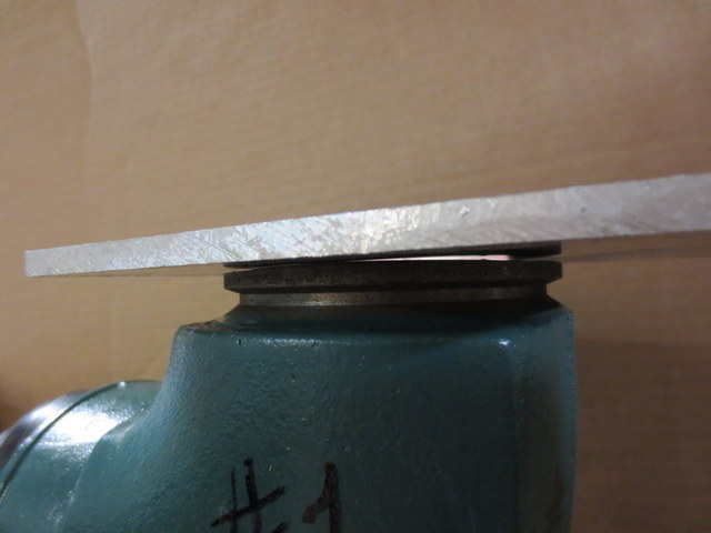 Flat plate on flange- showing wavy flange ( light placed inside elbow) exposed light reveals deformed SS liner. HGE 1289 Elbow.