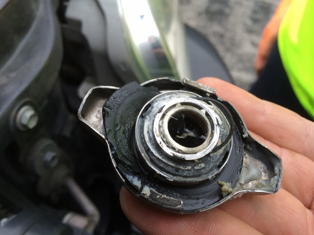 radiator cap damaged by overheating of white pasty substance