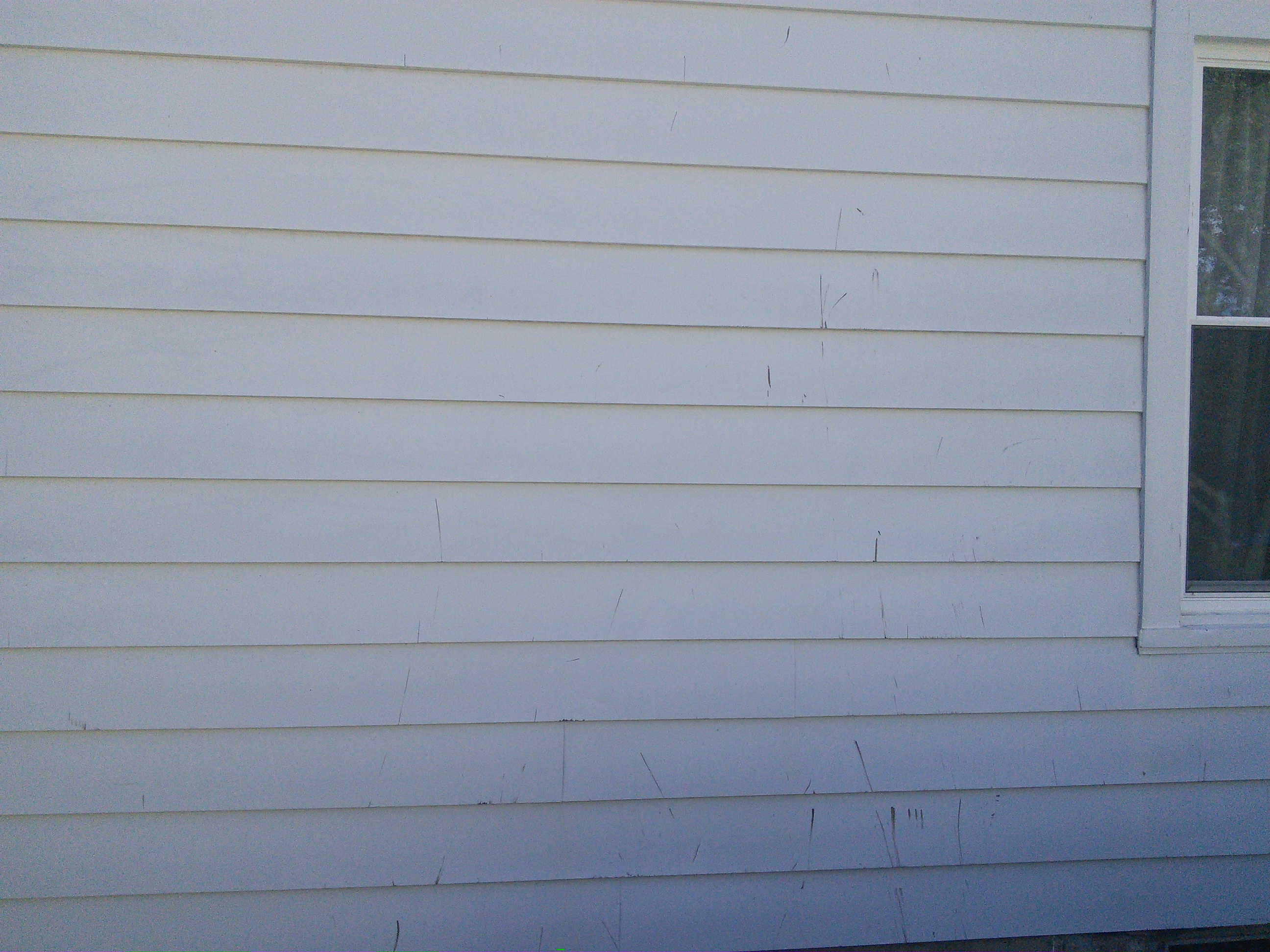 Side of house after roof. Granted, we did replaced siding anyone but shows how care less they were. 