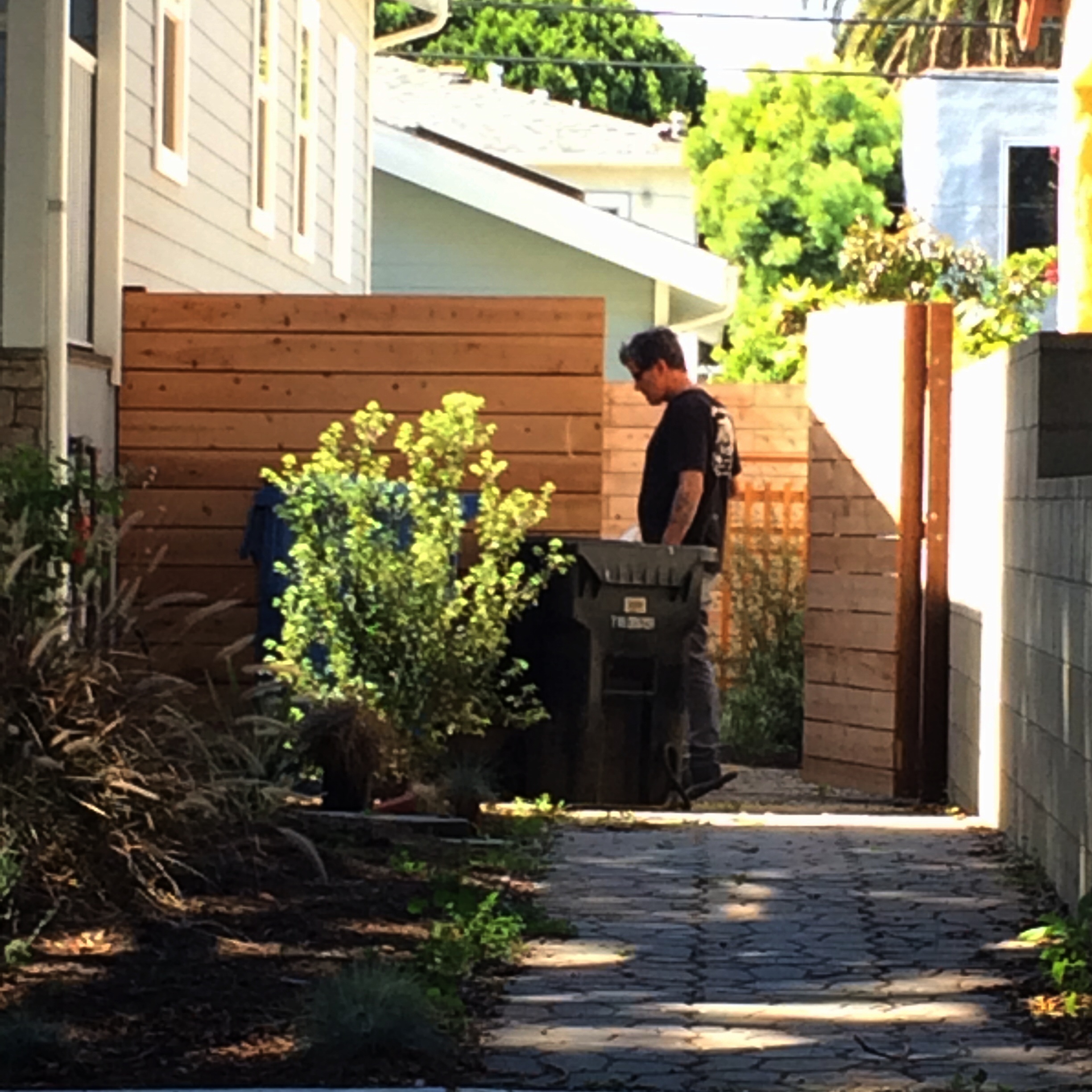 Some guy watering the property with MY WATER-paid for by....me. 