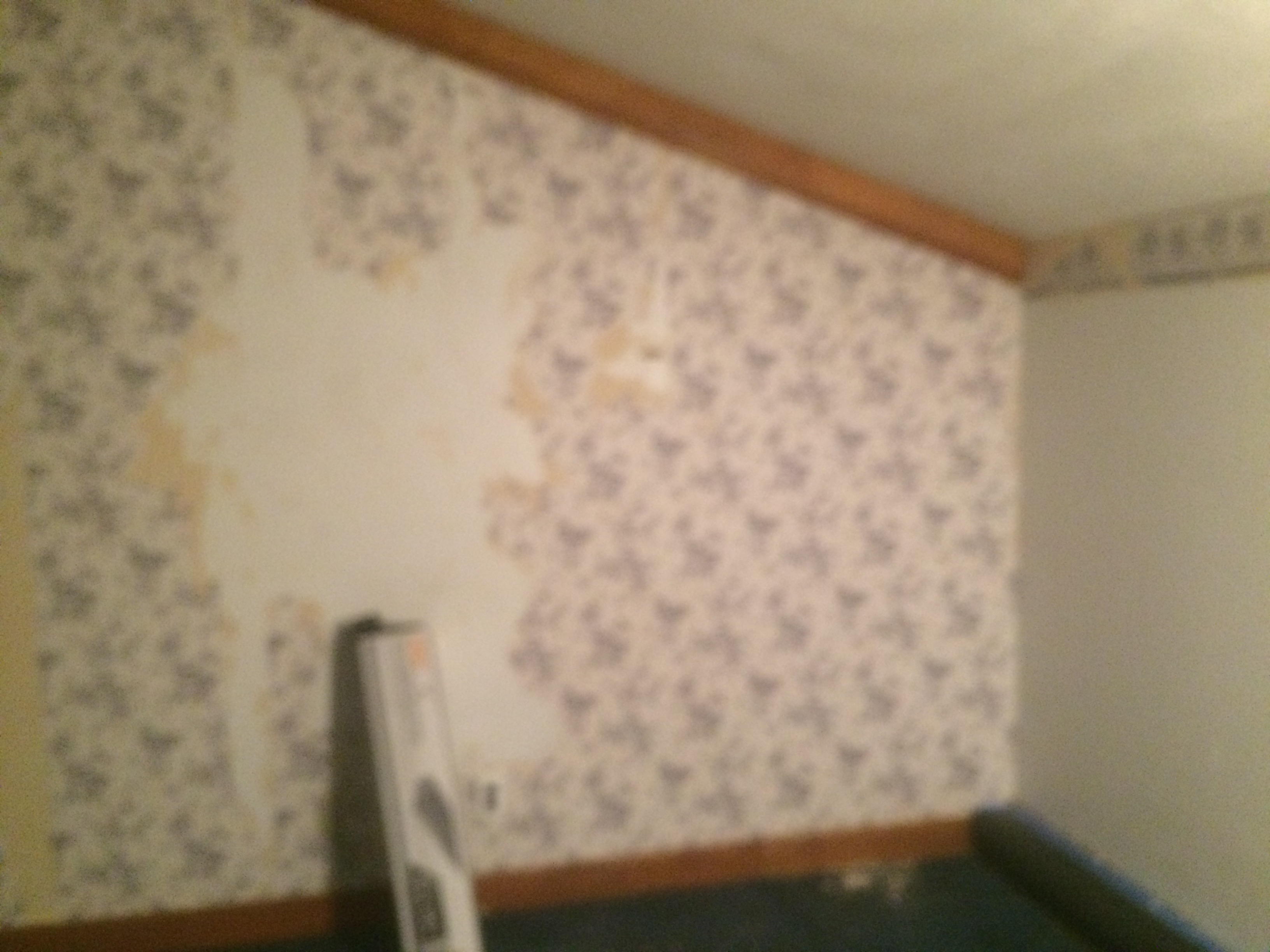 Wallpaper remaining on walls after we were told it was completely removed.