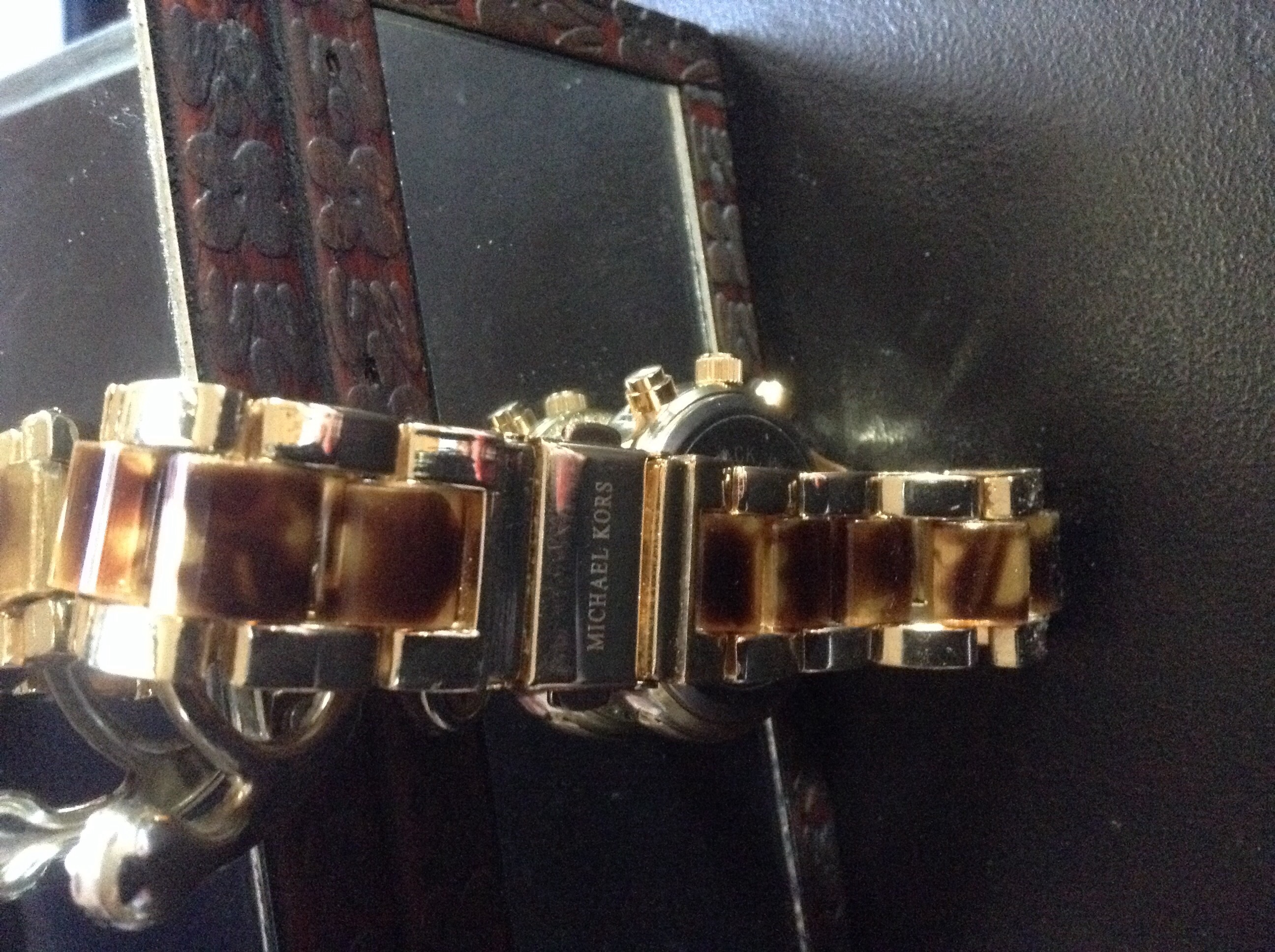 Micheal Kors Logo on double lock band