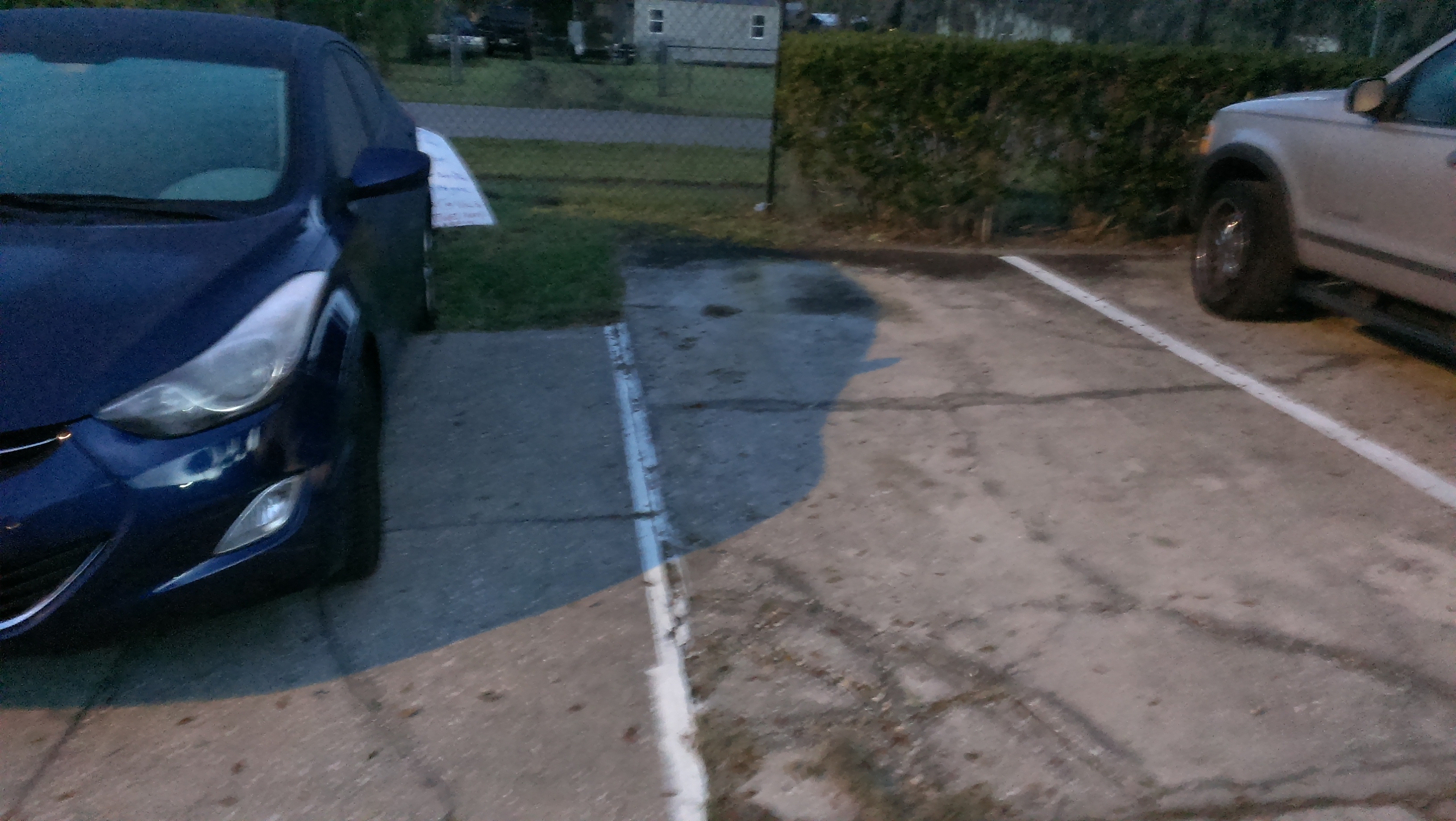Notice other parking spot is 3 feet longer.