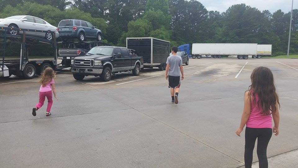 The pickup and trailer with the kiddos