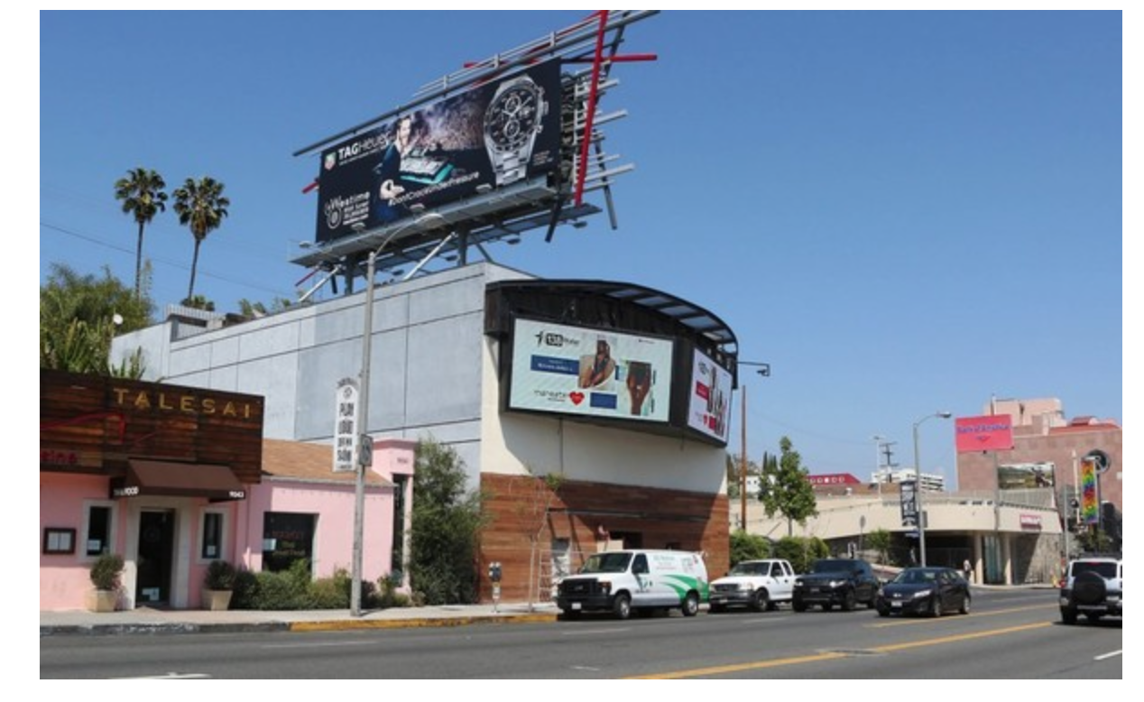 Renay Wells of Maneater Swimwear / billboards Display from Campaign she never paid for, defaulting on contract and breaching business agreement.