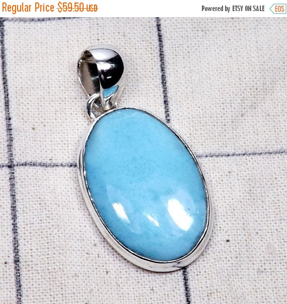 Larimar pendant , looks fake and unlike other larimar if you look in google images, lacks the natural crackling and turtle shell like patterning most larimar has, i should of known. 
