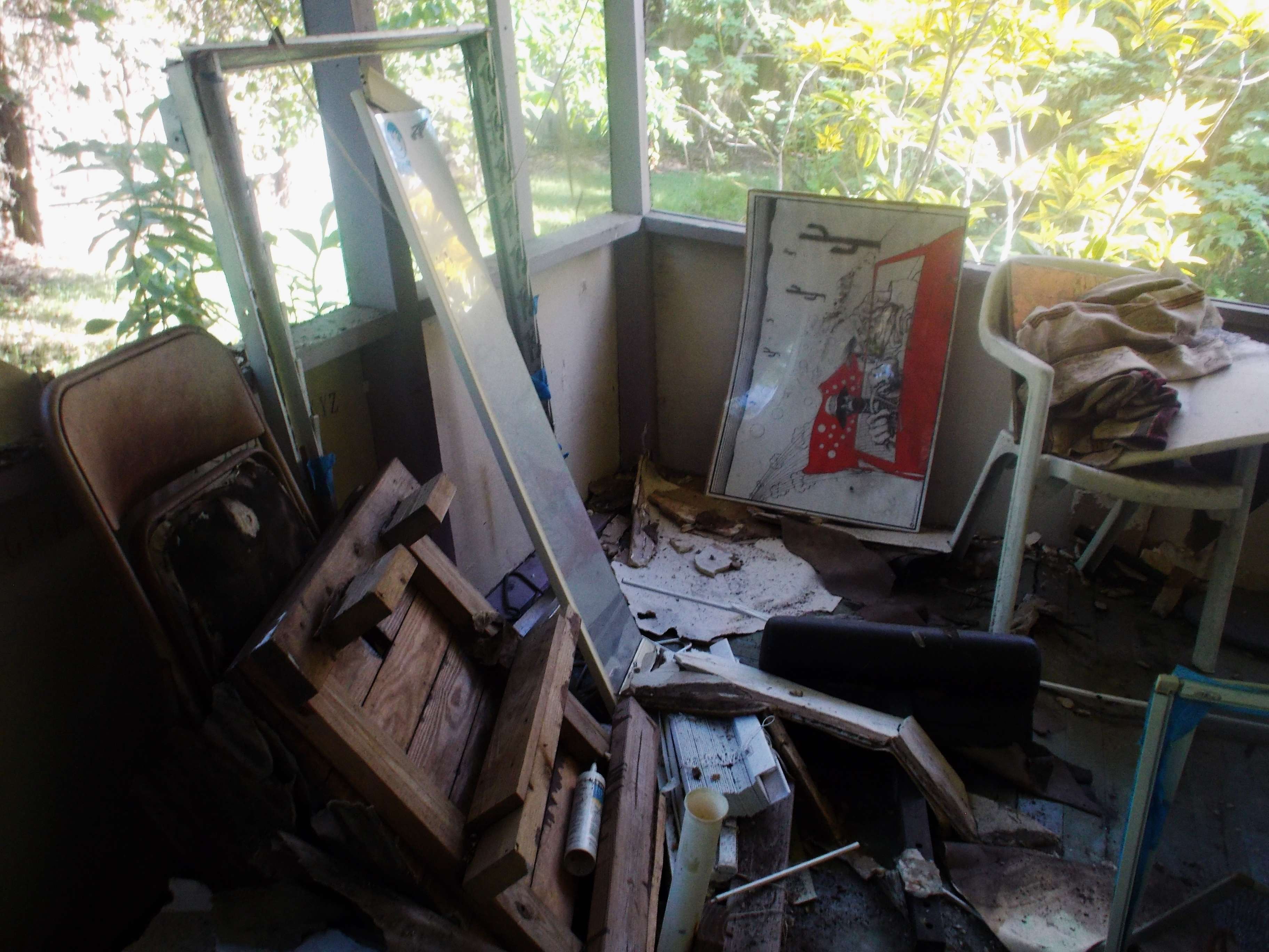 collapsed roof in one of her units she collects rent on / conditions have remained for over six months with out repair