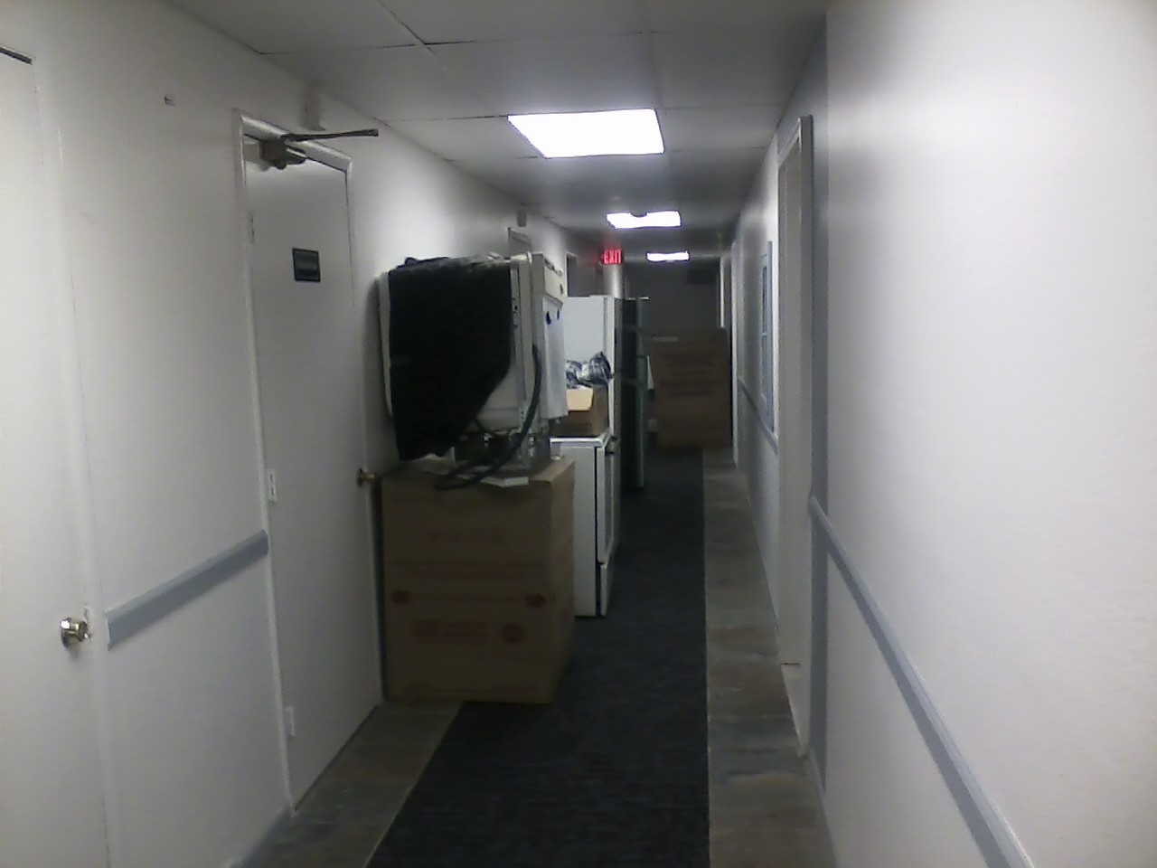 Old appliances stacked in the hallways after a resident demanded they be moved out of the storage locker room.