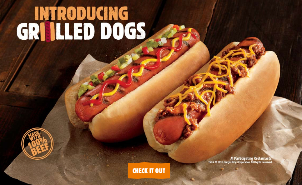 Website image of HUGE hot dog hanging out of the bun.