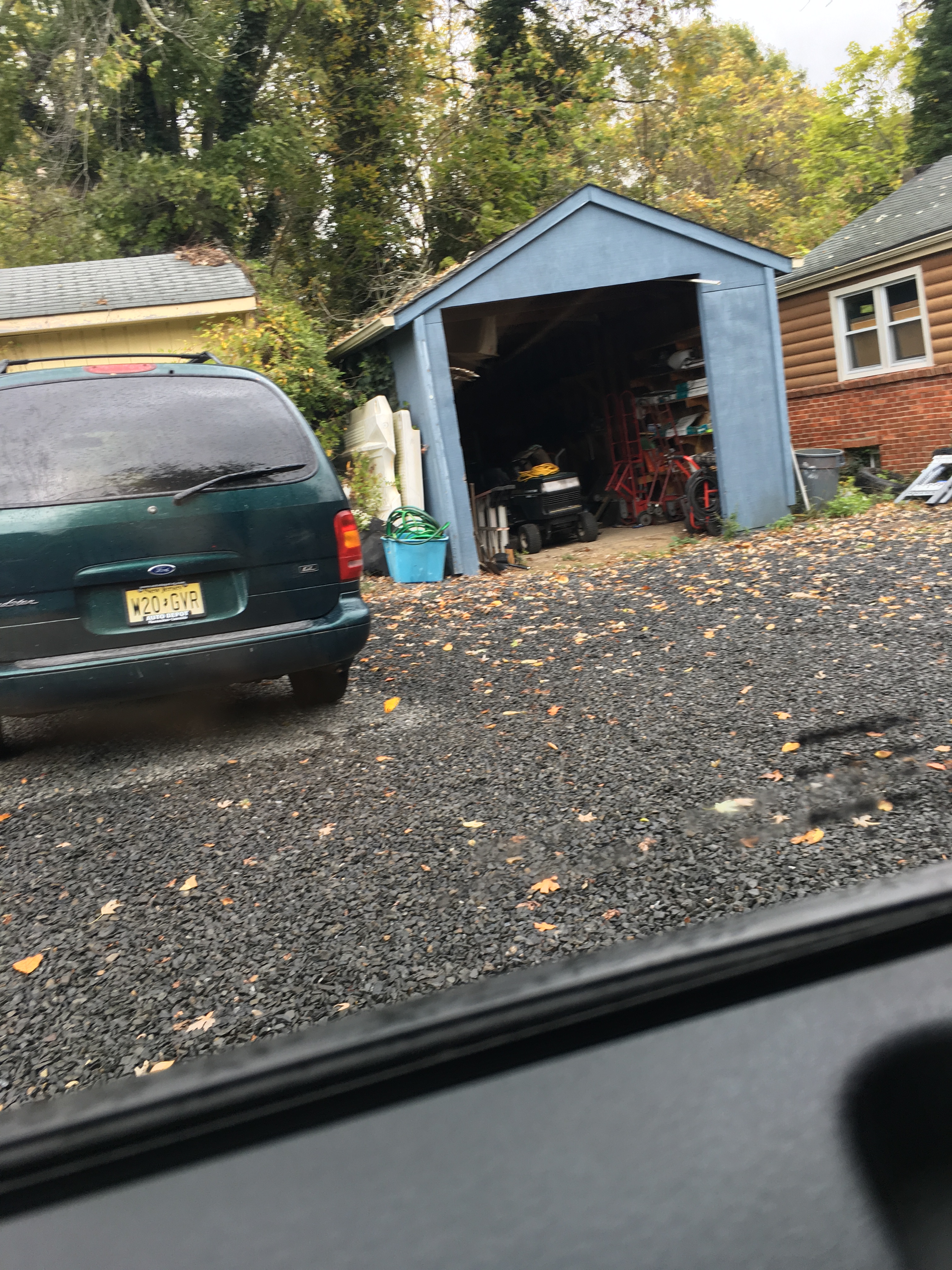 Gary's shed where he stores stolen equipment, his Minivan.  Notice the plate number.