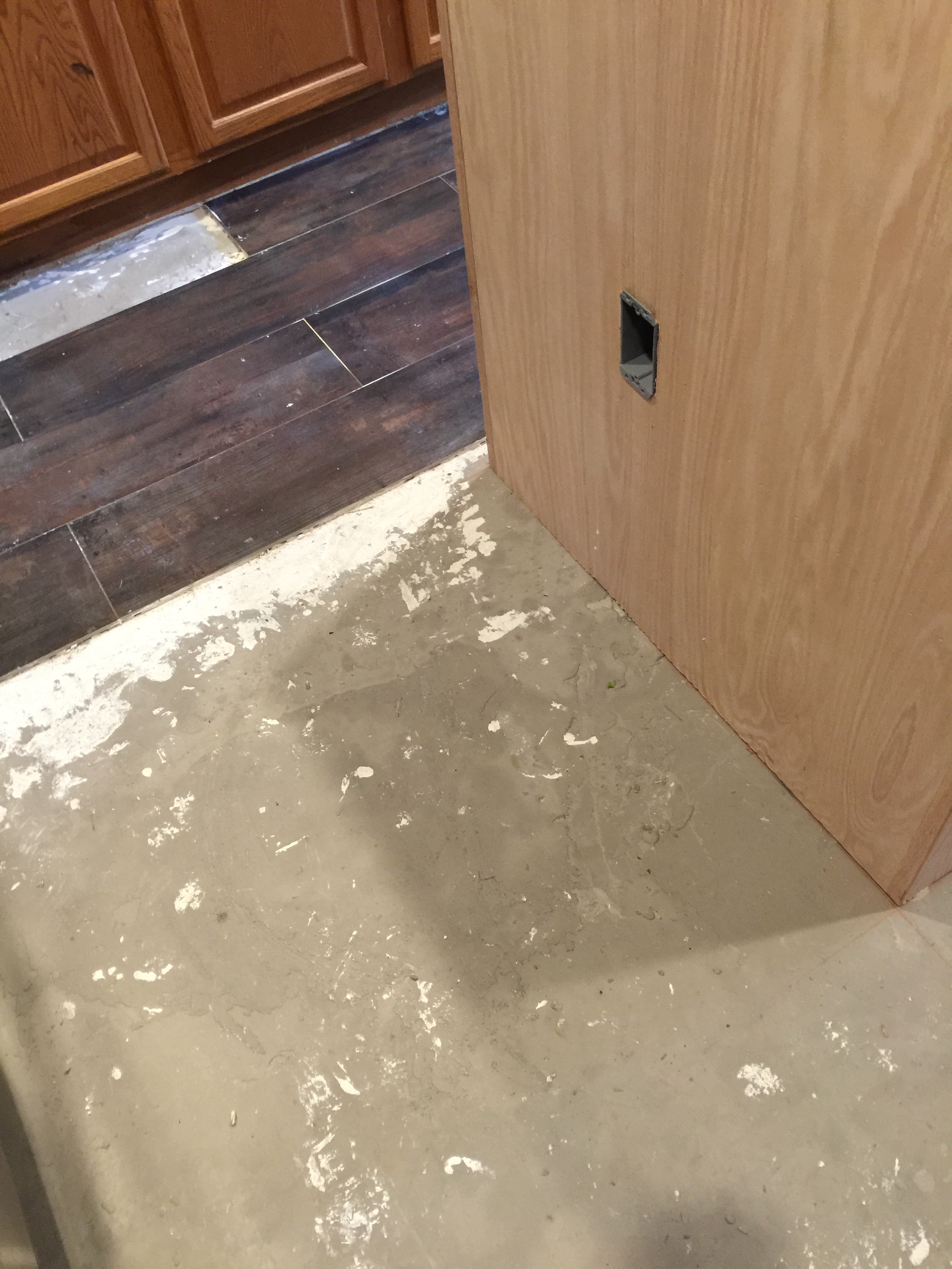 Unfinished tile and kitchen island. 