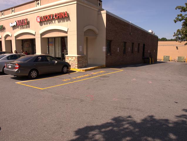 The car sitting right next to yellow triangle is the EPS employee.  This is in the Georgetown Shopping Center.