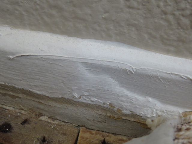 Urine in padding soaked into baseboard