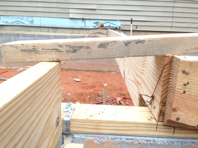 EXAMPLE OF HOW OUT OF SQUARE THE ENTIRE FOUNDATION IS. THIS IS 2 JOISTS THAT ARE NOT LEVEL.