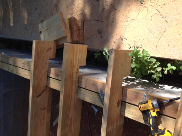  THE FOOTINGS WERE POURED IN THE WRONG PLACE. SINCE THIS HAPPENED THE CONCRETE BLOCK WAS STACKED (SOME W/O MORTER) AT THE BACK EDGE OF THE FOOTING RESULTING IN A LARGE GAP BETWEEN THE EXISTING FOUNDAT