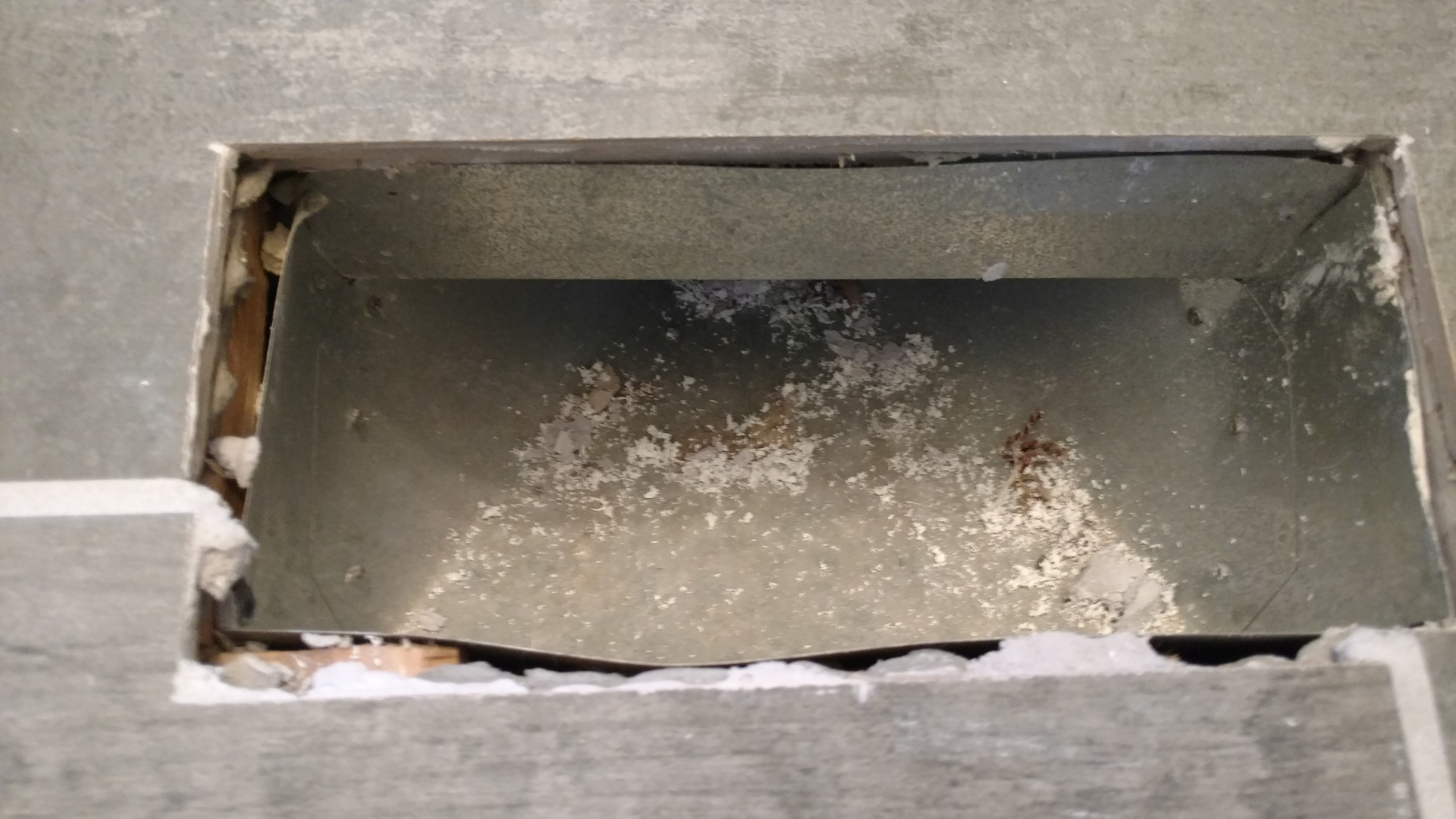 Rubble in floor vent from bathroom