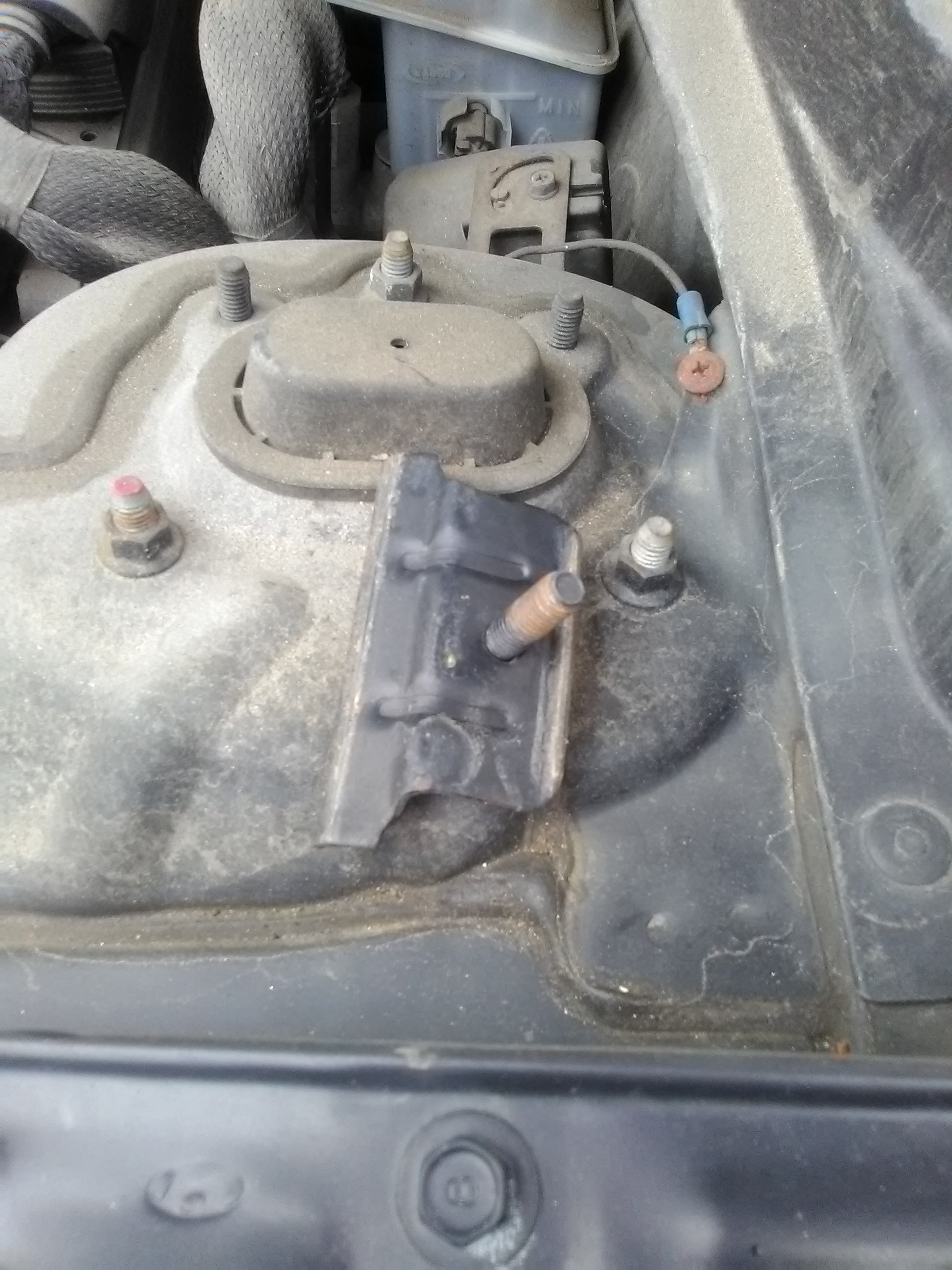 Under hood where Mechanic left screws off