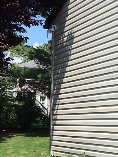 loose cables left on the side of the house