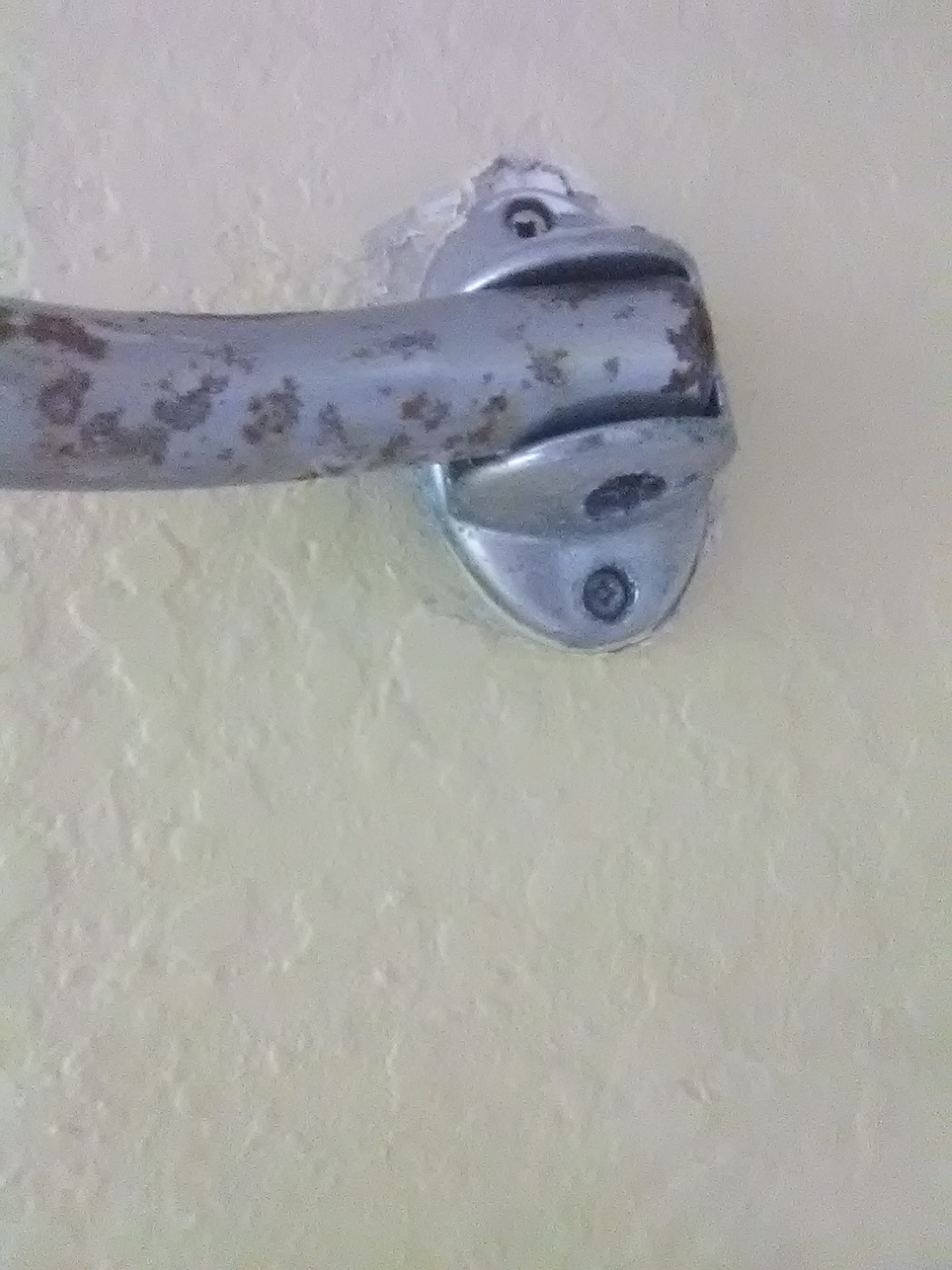 Shower rod flaking off chrome and rust.