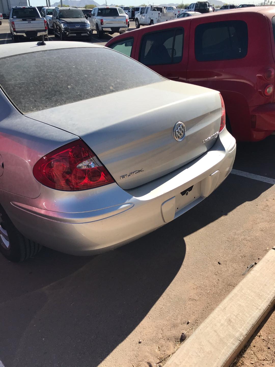 "K" on Buick logo on trunk missing in dealer yard 