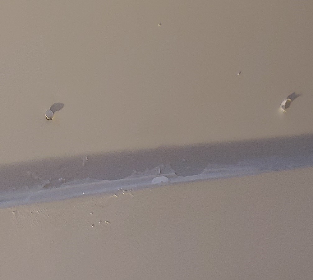 caulk smeared on the door frame