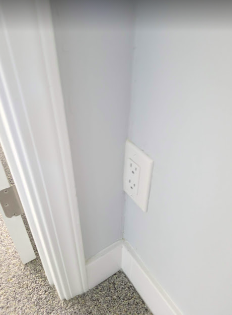 Non-compliant outlet because of unpermitted wall