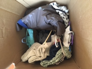 Clothing dumped into tall box, not wardrobe boxes