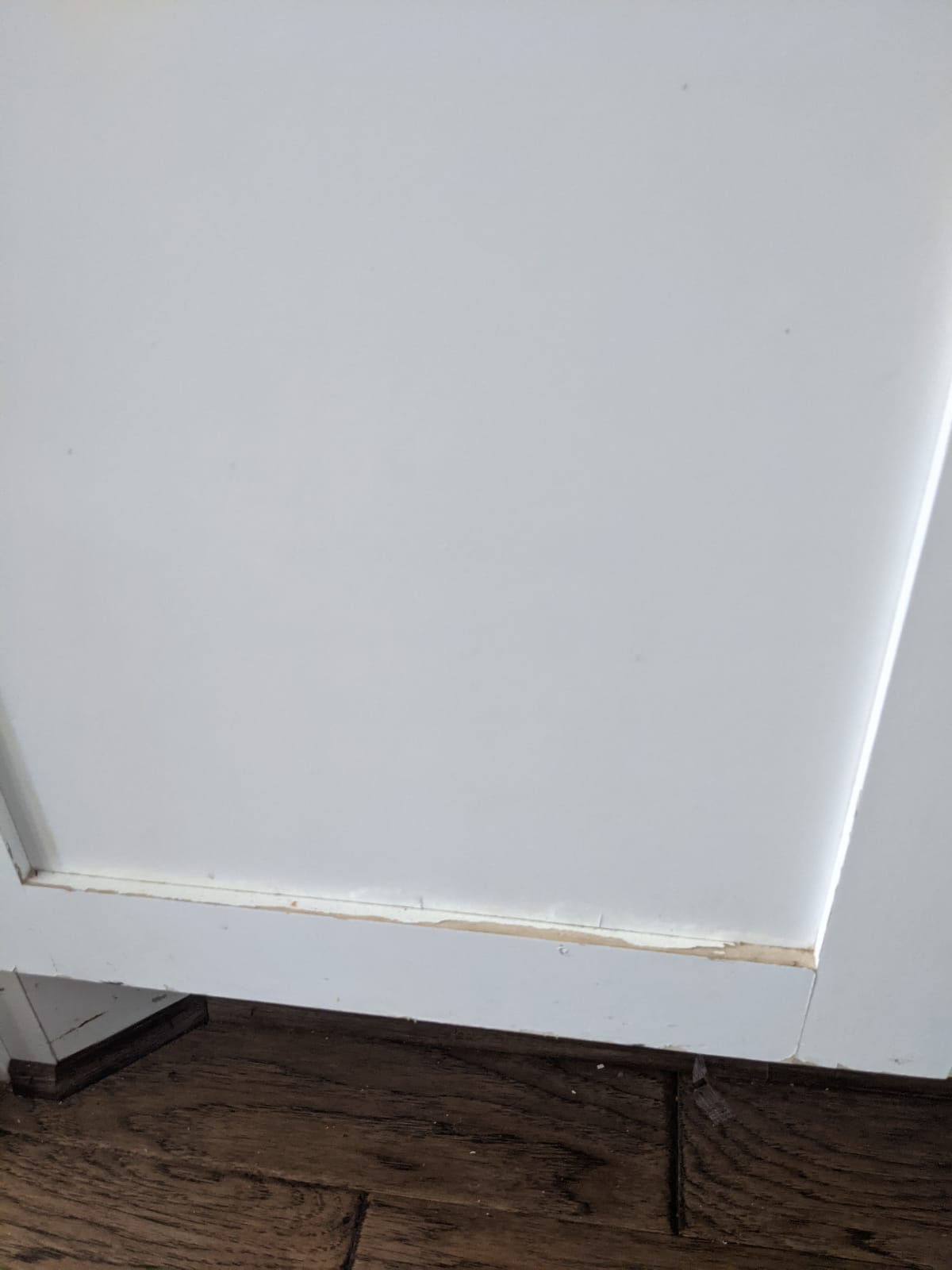 paint peeling off on corners on all cabinet doors.