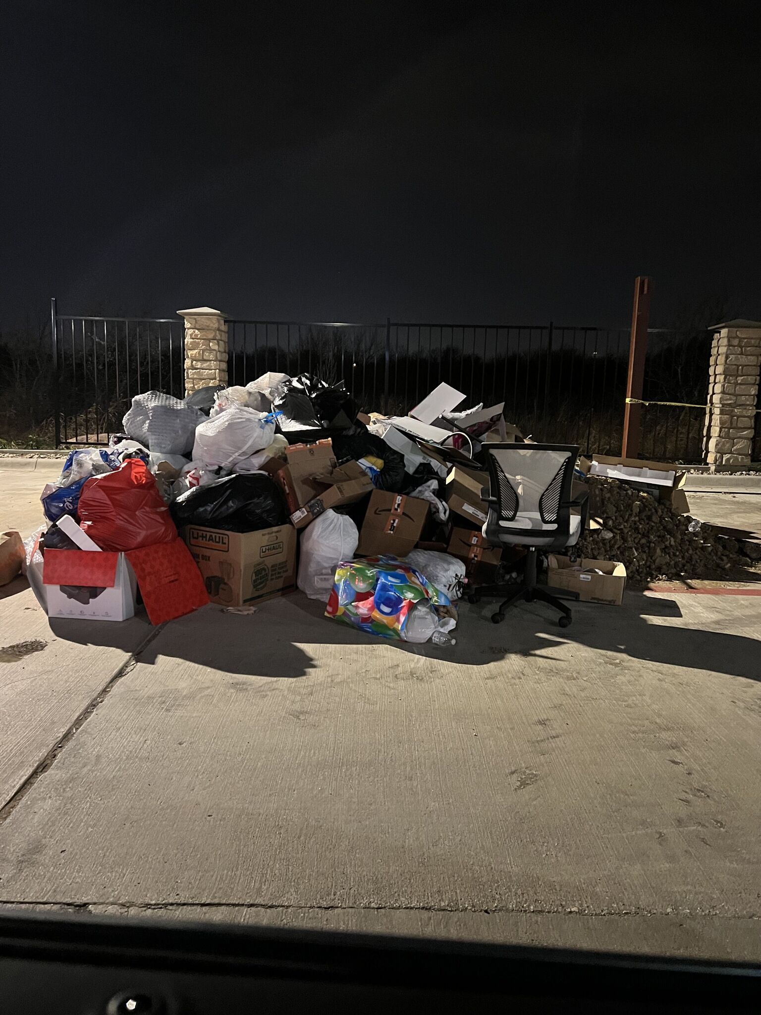 trash left outside because of overflowing dumpster
