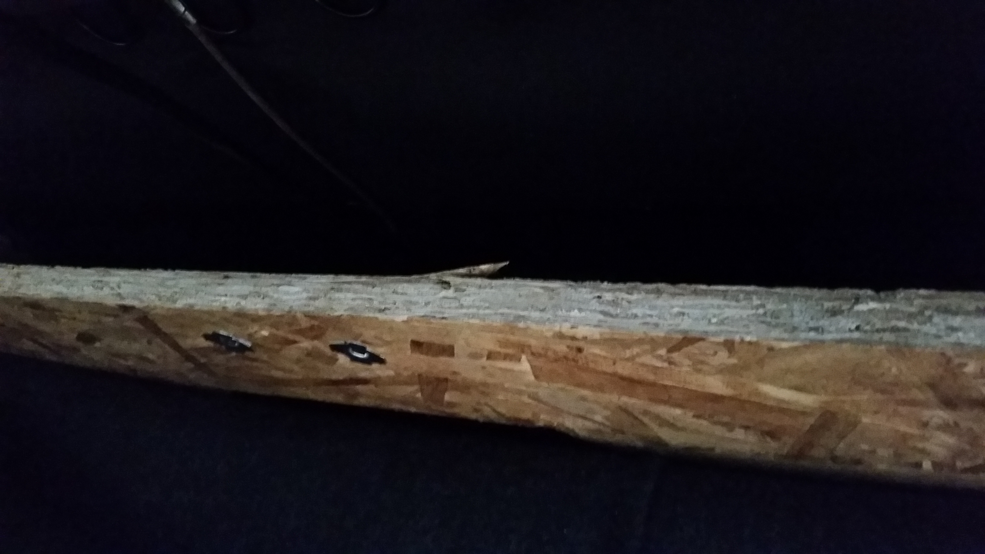 Cracked wood brace in headrest