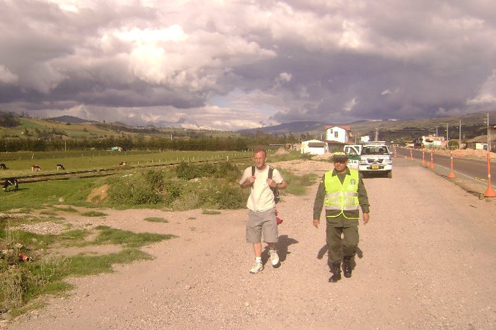 James Allen with Colombian national police helping him as he walked for his abducted child in Colombia