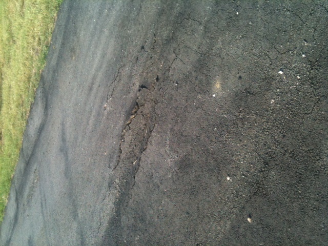 Ruts in driveway where it has been patched once already