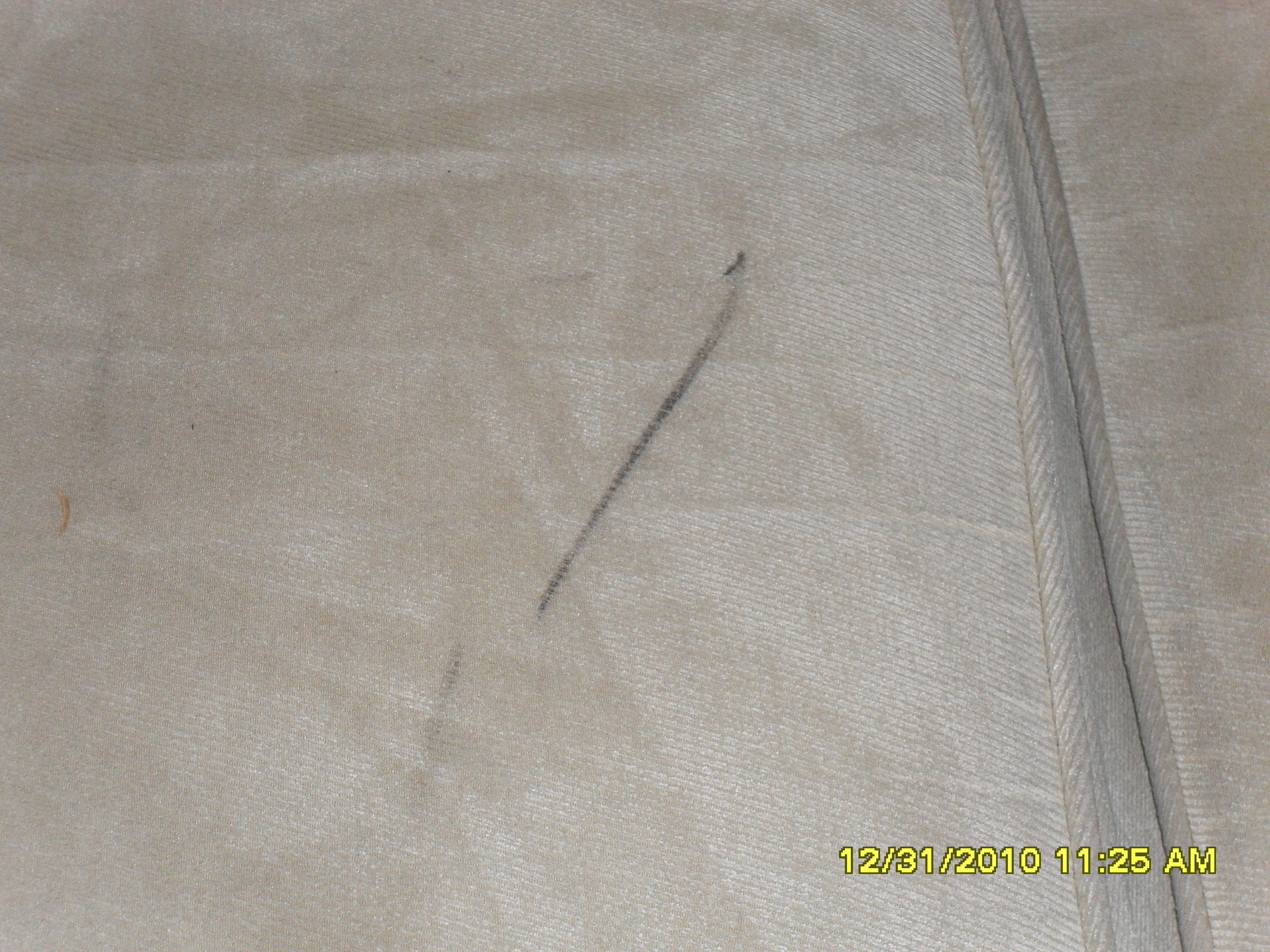 My sofa has a black mark on it that needs to be cleaned under my 7 year warranty with Stainsafe