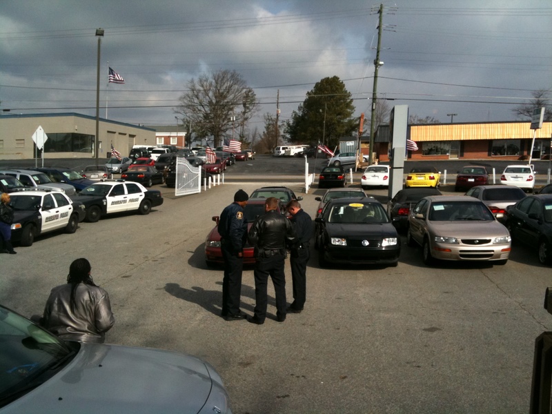 Police officers trying to figure out how to handle the violent suspect