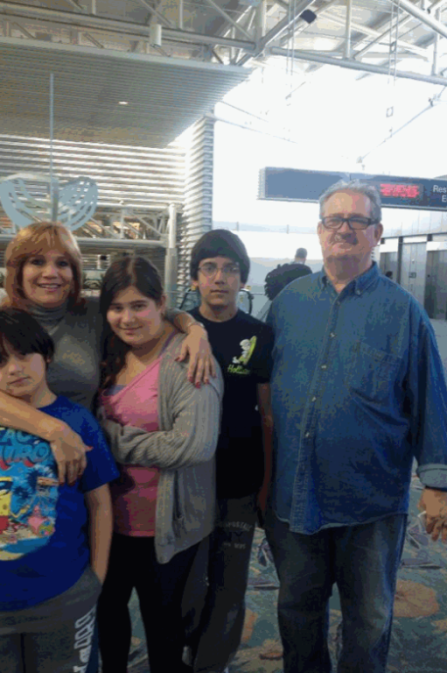 Bina and her Kids with Ron Mills -Ron is also involved in her scams...