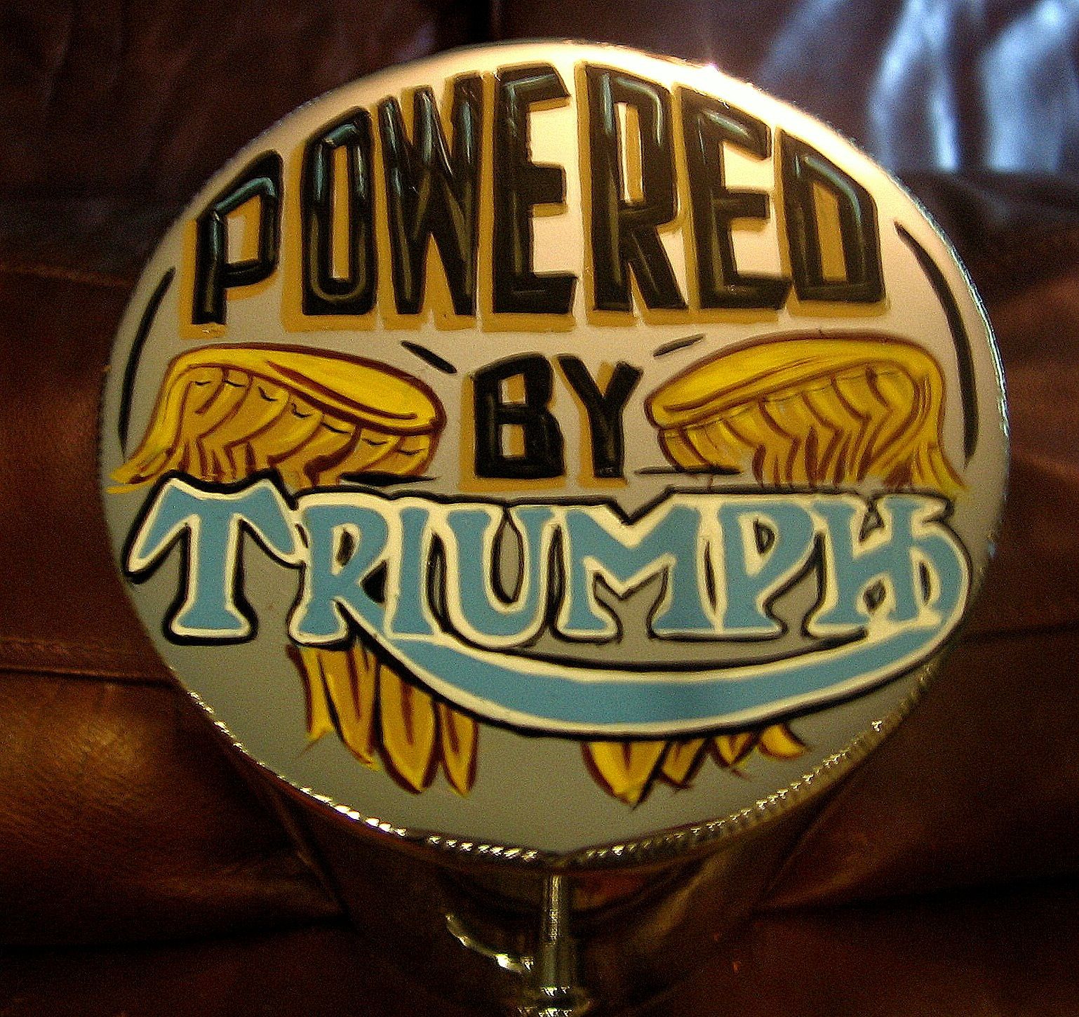 This is the job he did. You can see how the drop shadow on the black words "Powered By" is rust and was supposed to be ivory. The top of the T is too big and I sent him a copy of the Triumph logo from