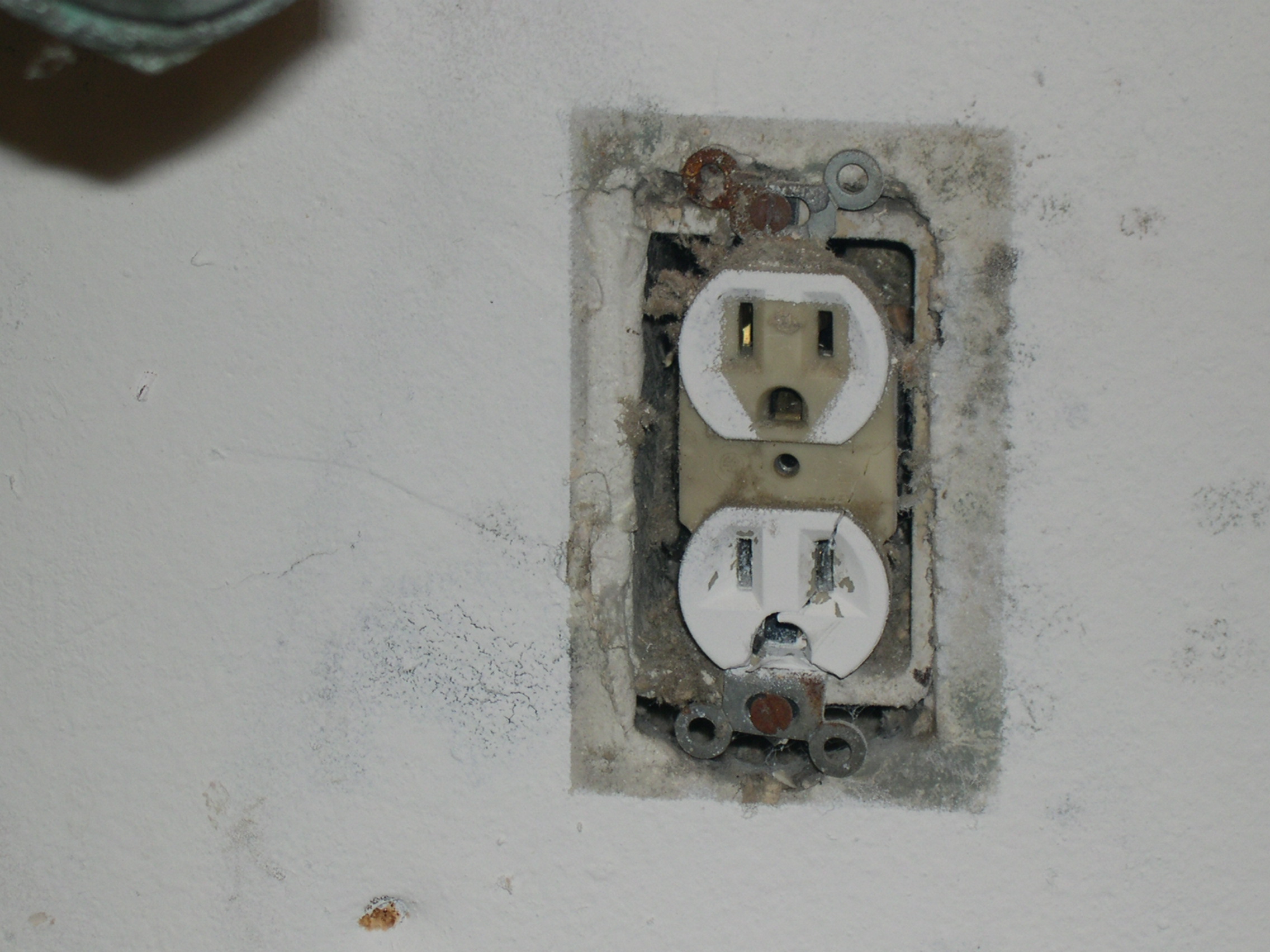 Molded electrical outlet that was painted around.