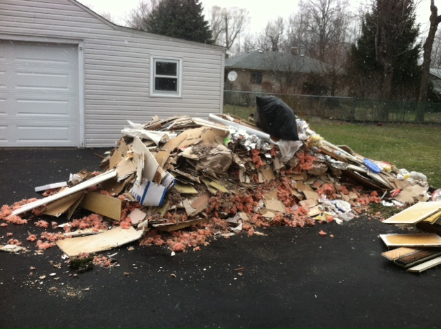 dumpster of construction debris he dumped in my drivewayNICE GUY HUH ??????DARE YOU TO HIRE HIM !!!!!
