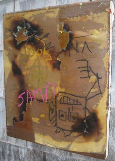 An "original" Basquiat that Kevin hung on his garage with the sun beaming down on it with no protection. Obviously fake.