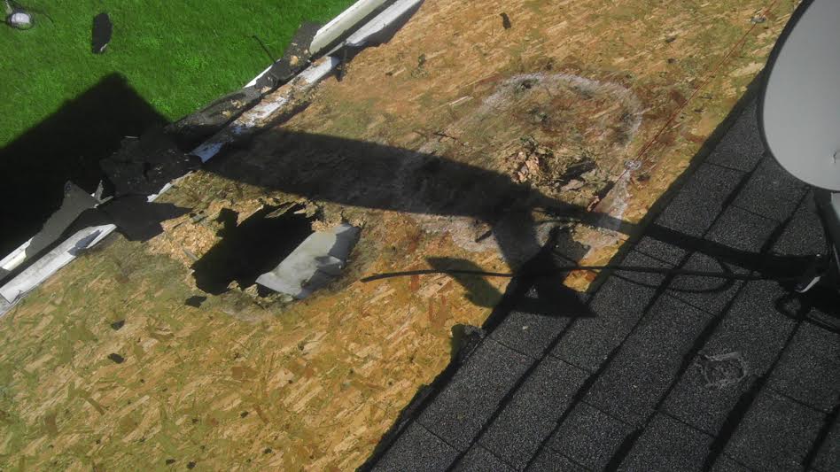 This hole in my roof was caused by DIRECTV's unauthorized satellite installation.