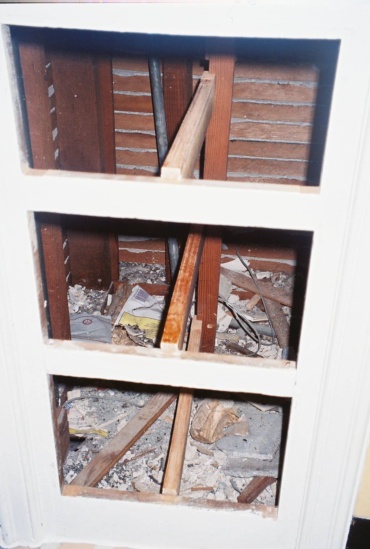 Woodworks/Back of bathroom closet.