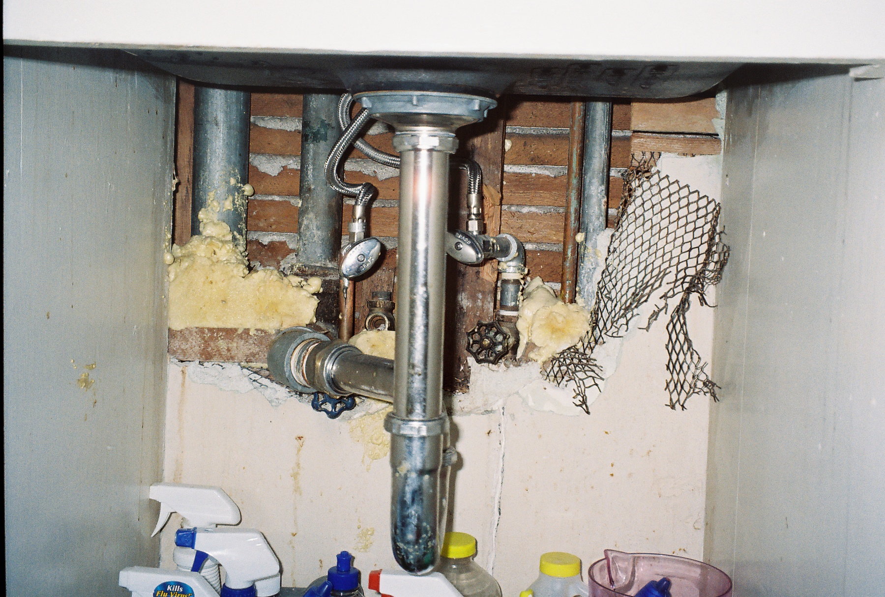 Hole under kitchen sink.